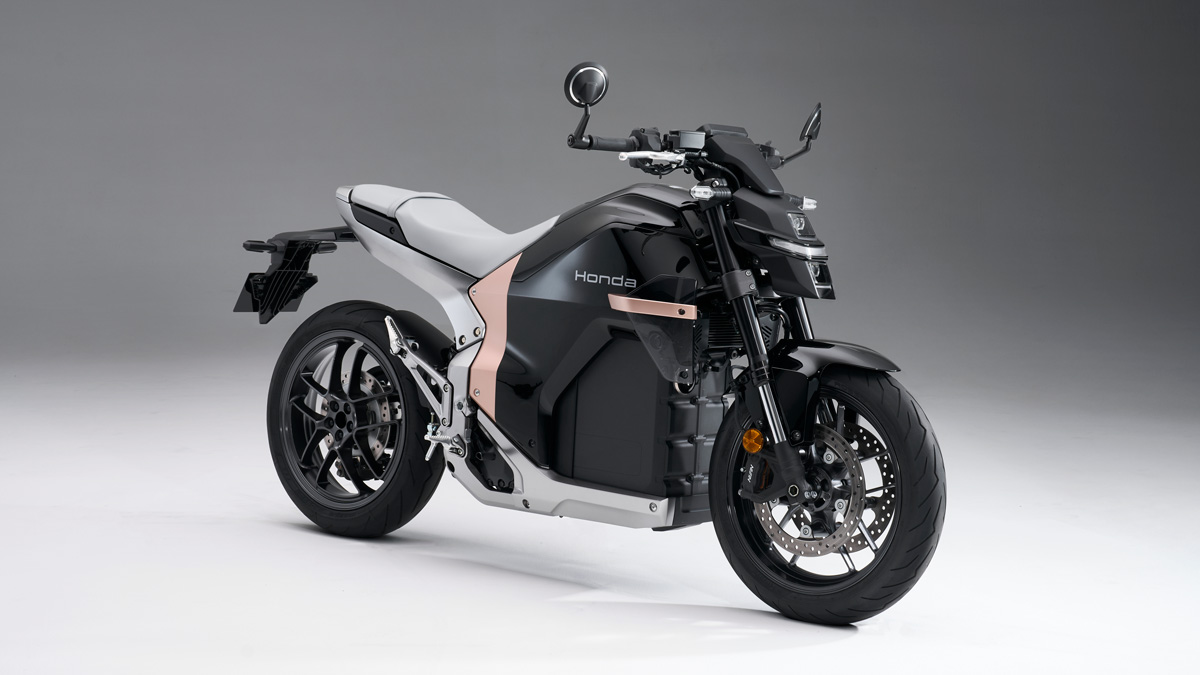 Honda WN7 electric motorcycle showcased at global launch, featuring futuristic aerodynamic design.