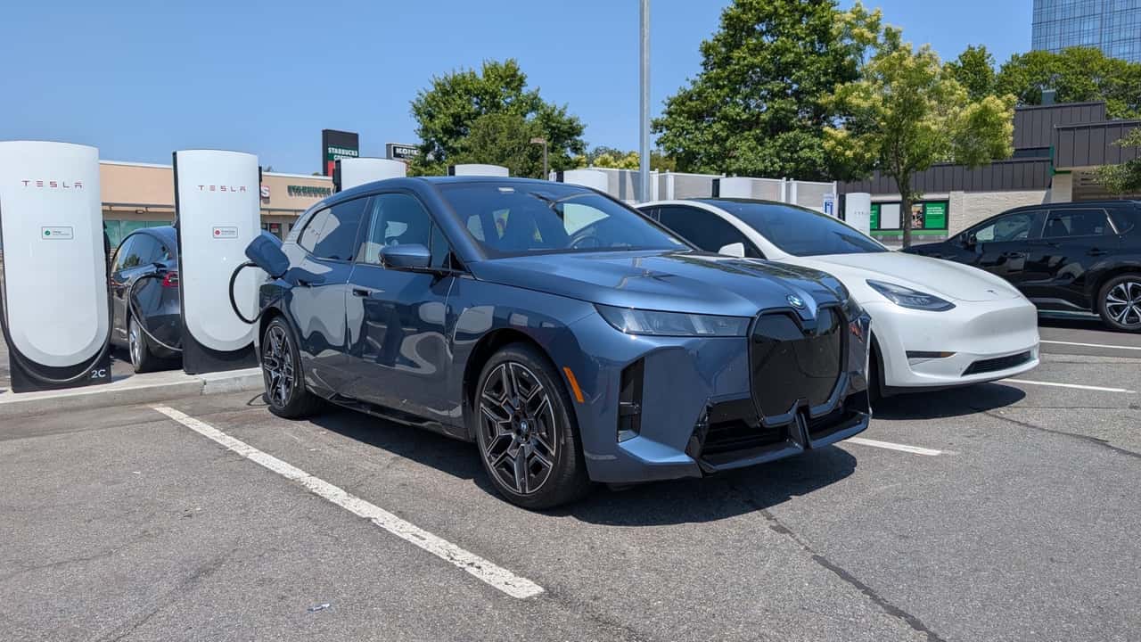 EV driver charging car at reliable fast charging network station