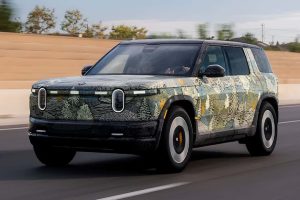 Rivian is investing $24 billion in factories, technology, and future EV platforms to scale production later, betting big on long-term growth in the electric vehicle market.