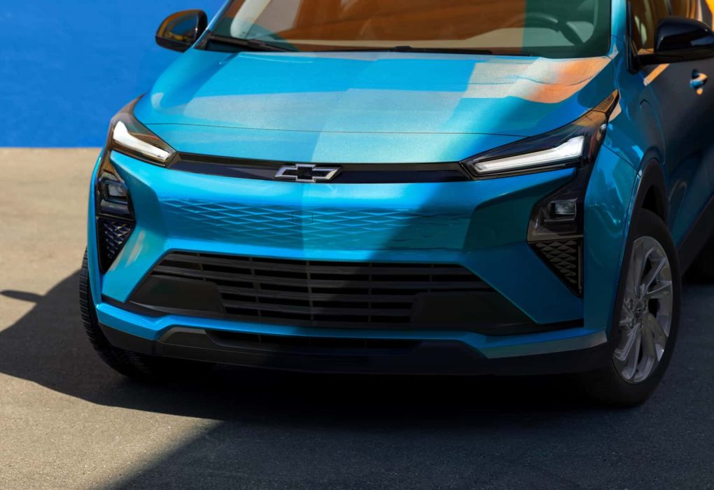 A 2027 Chevy Bolt charging at a Tesla Supercharger using its native NACS port.