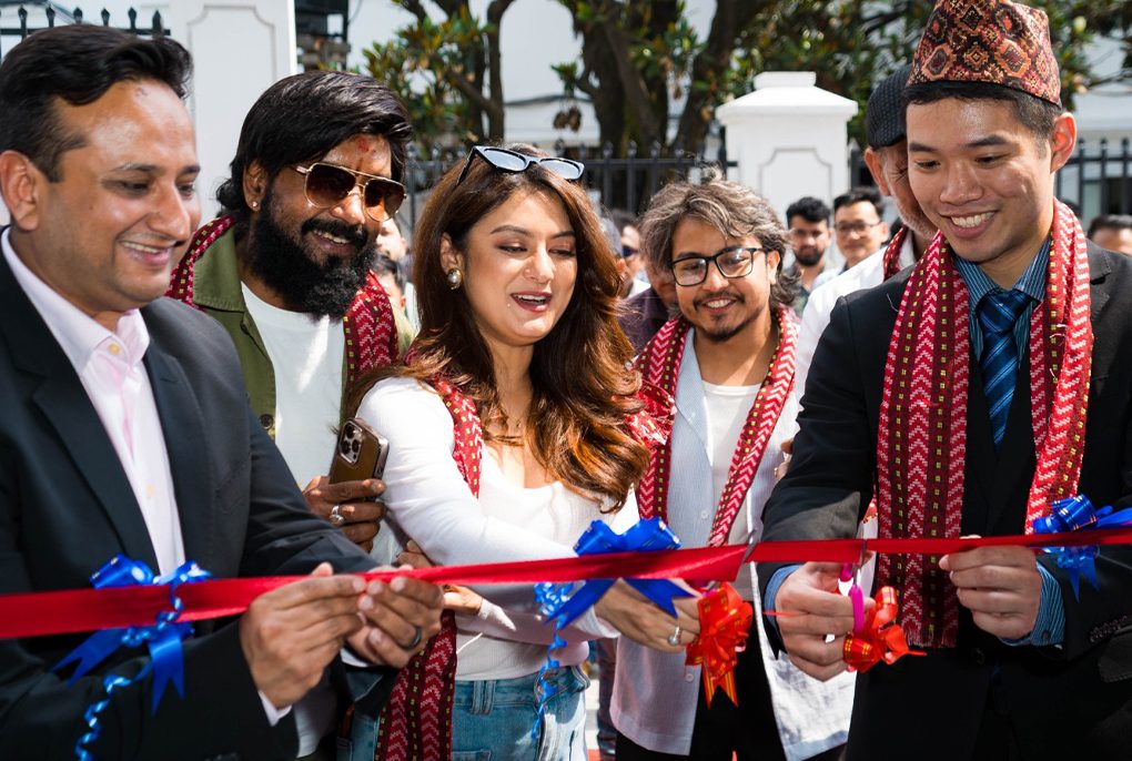 The modern glass exterior of the newly inaugurated GAC AION flagship showroom in Thapathali, Kathmandu.