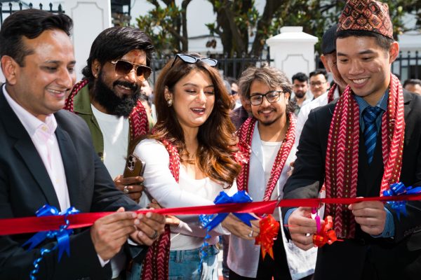 The modern glass exterior of the newly inaugurated GAC AION flagship showroom in Thapathali, Kathmandu.
