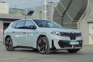 The 2026 BMW iX3 at a high-power charging station during a road trip