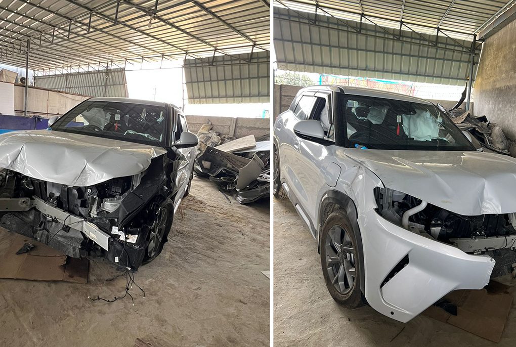 The front profile of a BYD Atto 2 undergoing inspection following a highway collision.