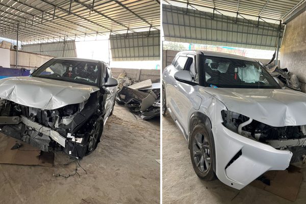 The front profile of a BYD Atto 2 undergoing inspection following a highway collision.