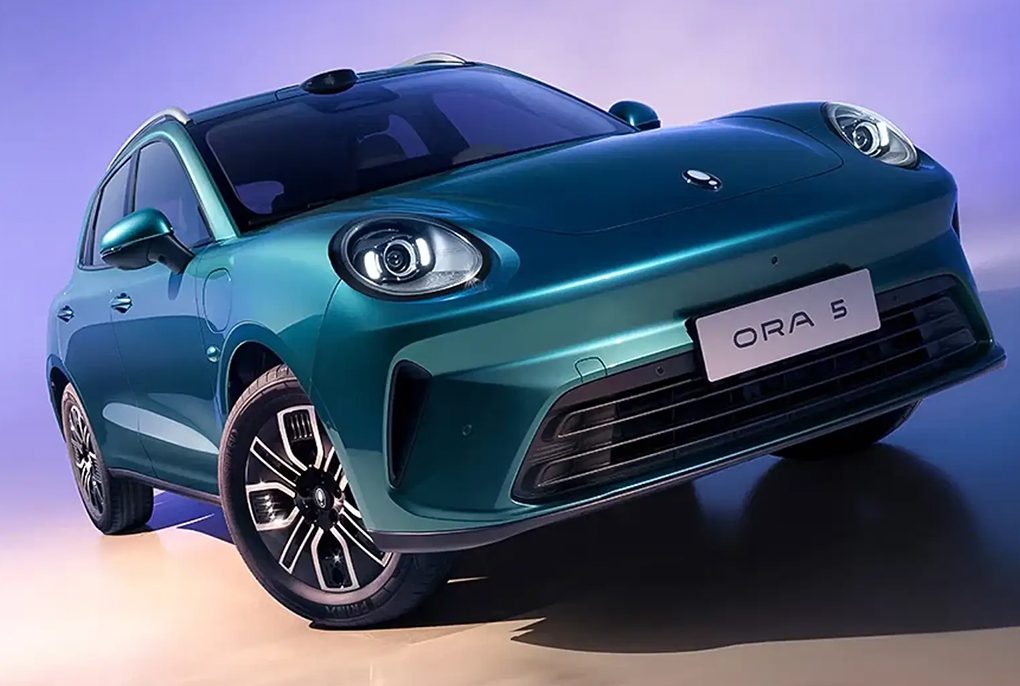 The side profile of the sleek, retro-futuristic GWM Ora 5 electric sedan showcasing its sweeping coupe roofline.