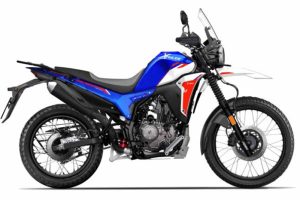 A rugged, adventure-ready Hero Xpulse 210 motorcycle in Alpine Silver color, showcasing its high-mounted front fender and spoked wheels.