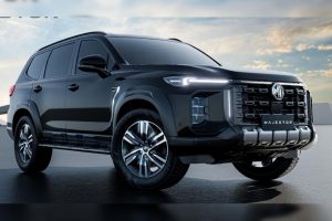 The aggressive front look of the new black MG Majestor SUV highlighting its massive gloss-black grille and vertical LED headlights.