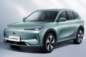A clean side profile of the newly rolled-out Proton e.MAS 7 electric SUV highlighting its aerodynamic silhouette inside a premium regional assembly plant.