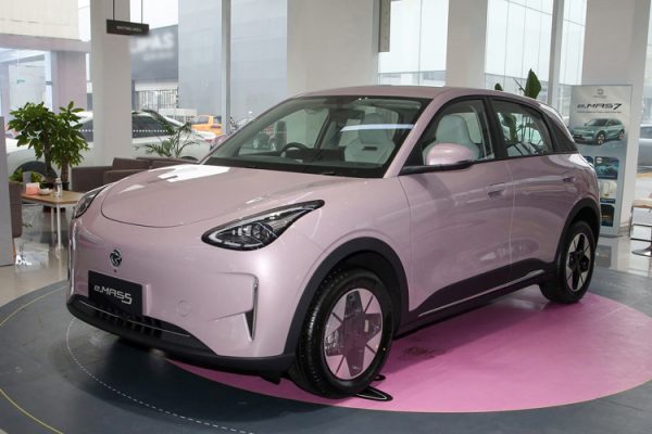 Front view of the vibrant, compact Proton e.MAS 5 electric hatchback showcasing its clean "Smile" design language.