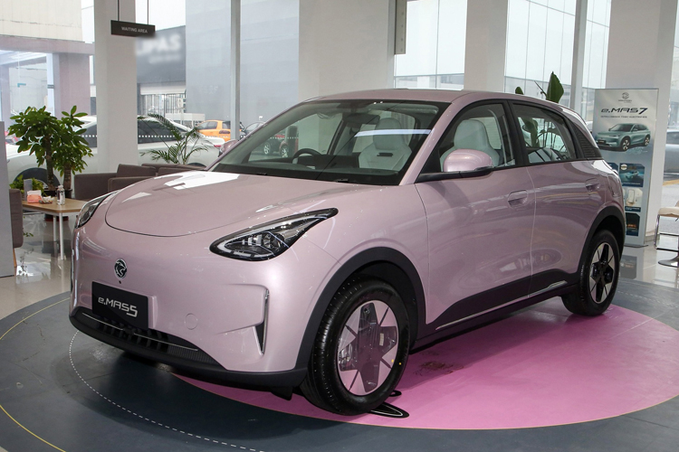Front view of the vibrant, compact Proton e.MAS 5 electric hatchback showcasing its clean "Smile" design language.