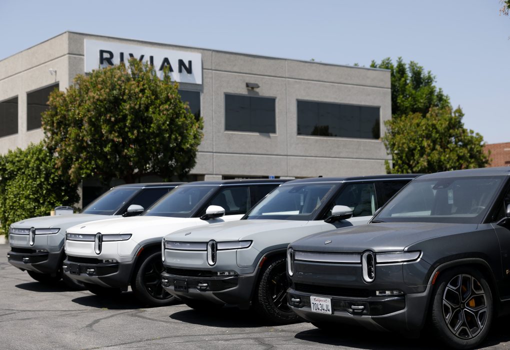 The sleek front fascia of the newly launched Rivian R2 electric SUV parked under studio spotlights