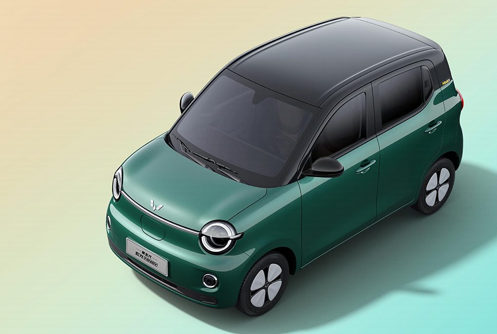 The newly redesigned four-door Wuling MINIEV hatchback displayed at a premium showroom event