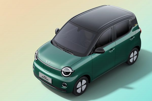 The newly redesigned four-door Wuling MINIEV hatchback displayed at a premium showroom event